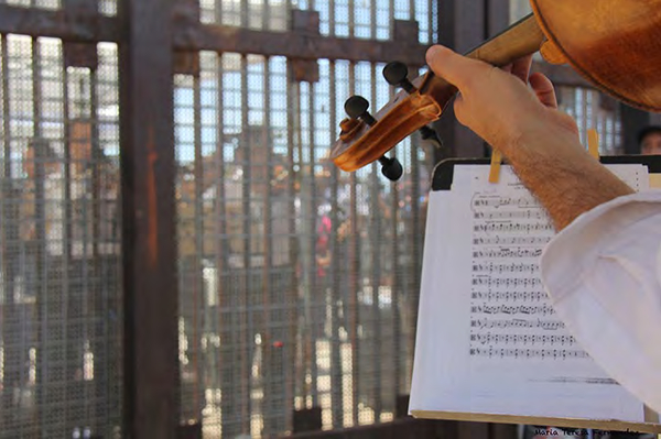 Musicians from the San Diego Symphony and Orquesta de Baja California perform on both sides of the border fence in Friendship Park on July 6.Photo credit: Maria Teresa Fernandez