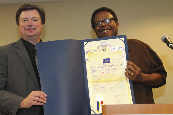 ICSOM Chair Bruce Ridge and LA Philharmonic delegate John Lofton, holding the proclamation by the LA County Board of SupervisorsPhoto credit: Leslie Shank