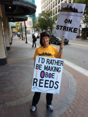 PSO Oboist Cynthia Koledo DeAlmeida walks the picket line in October Photo credit: Peter de Boor